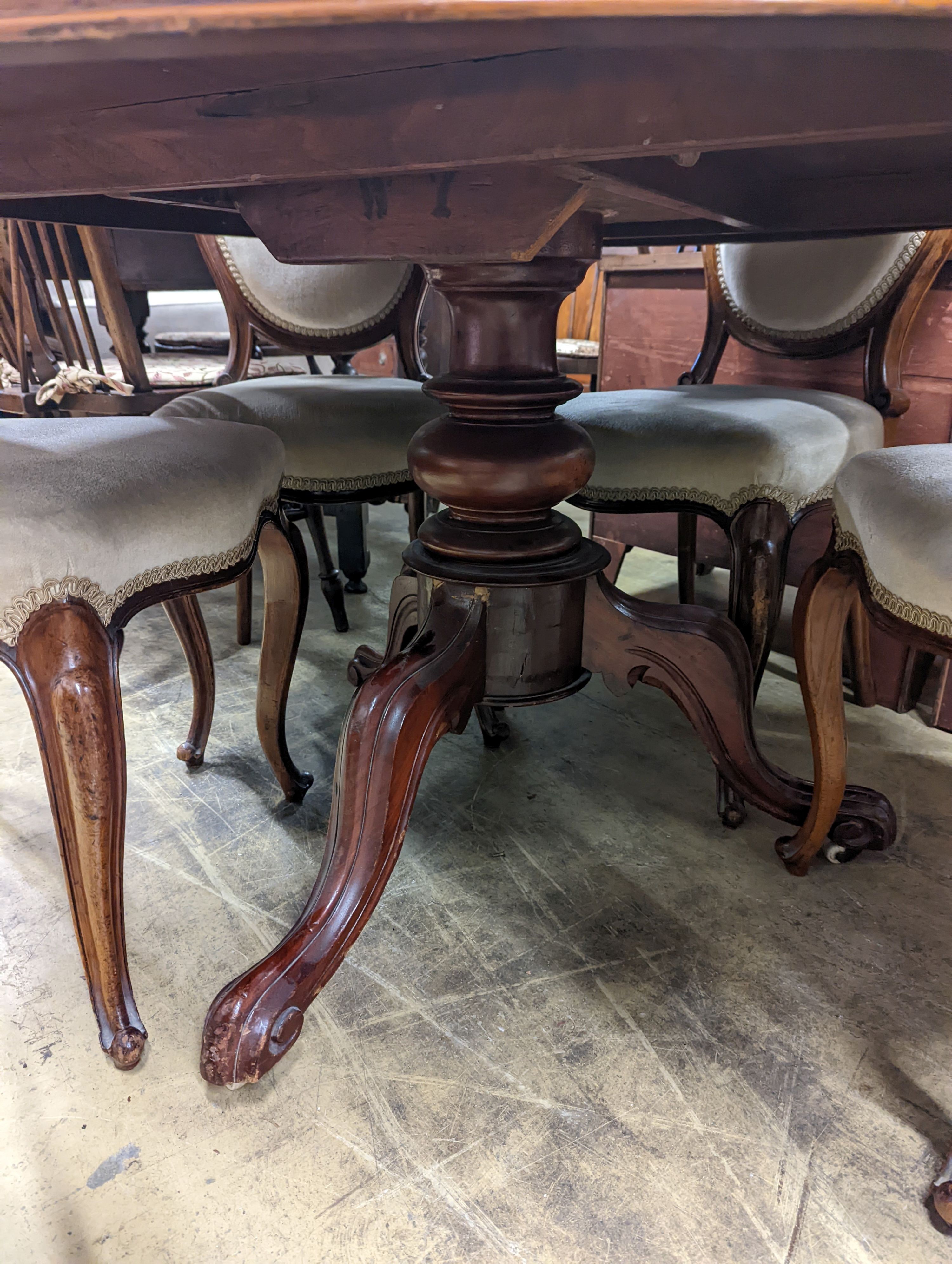 A set of six Victorian mahogany upholstered balloon back dining chairs together with a Victorian mahogany circular breakfast table, diameter 118cm, height 72cm